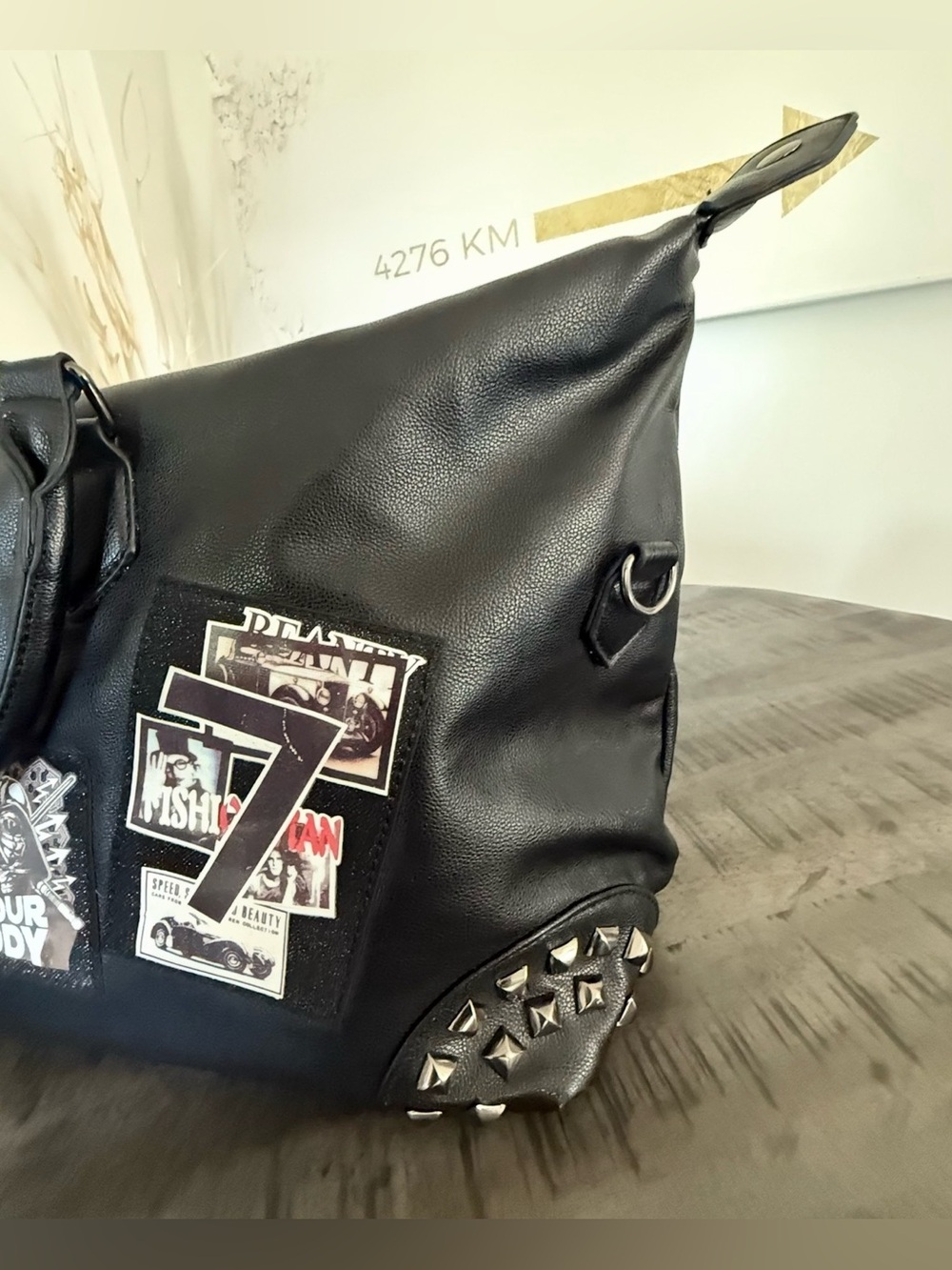 Black Studded Duffel Bag with Graphic Patch